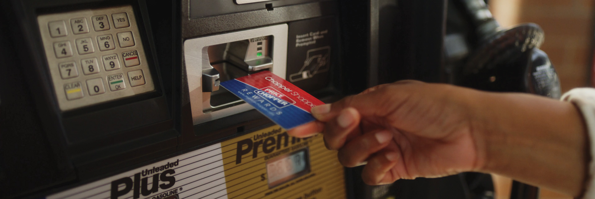 Reward card being used at gas pump