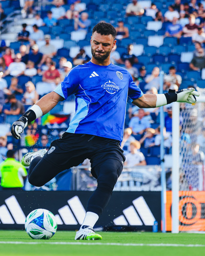 Sporting KC player kicks a ball